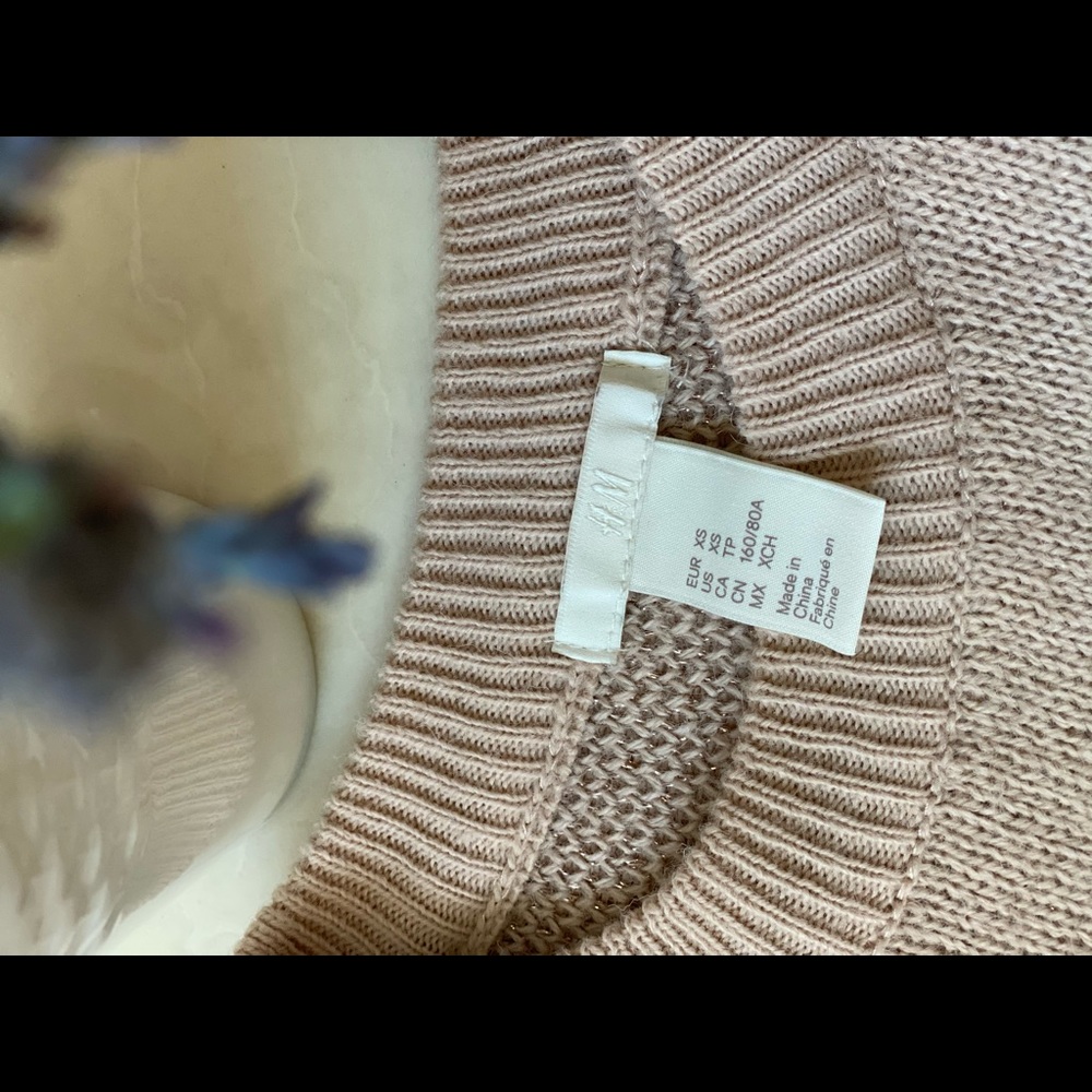 H&M’s sweater in light pink color.